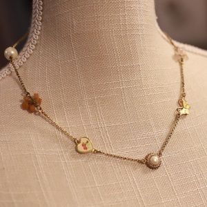 Juicy Couture Y2K Necklace with Pearl, Beads, Butterfly charms on Gold Chain